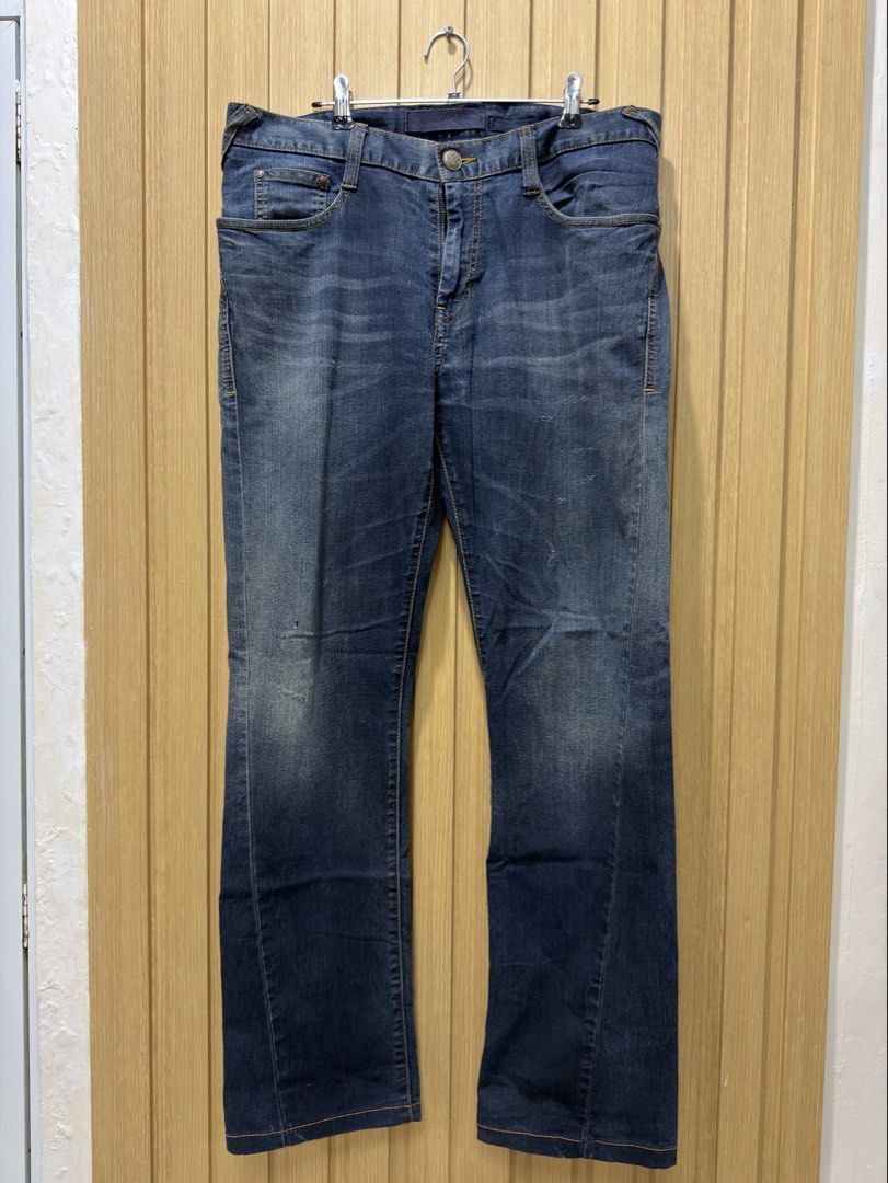 Evisu Dark Wash Denim Jeans Size 32 (Category: Jeans) located in Bacoor. Submitted by preloved_with_love_ (Listing ID 1467253519, Image 1). Description: - Brand: Evisu - Style: Dark wash denim jeans with regular fit - Size: Waist 32 - Details: Iconic painted seagull logo on back pockets, button fly with branded hardware, and unique geometric printed inner lining - Condition: Ready to wear, classic street style staple.