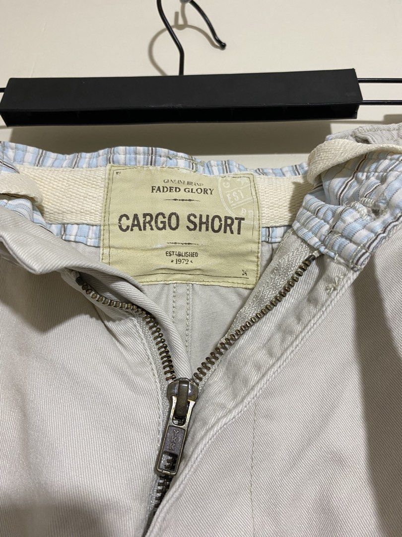 FADED GLORY,Cargo shorts (Category: Shorts) located in Cavite. Submitted by jc_thrift95 (Listing ID 1467333565, Image 3). Description: - a pair of light beige or cream-colored men’s utility cargo shorts featuring a button fly, cream-colored drawstrings, and multiple pleated cargo pockets on the sides. - Made in Bangladesh - L- 22 inch - W- 18 inch - Color rate 8/10 - See picture details for dimes..