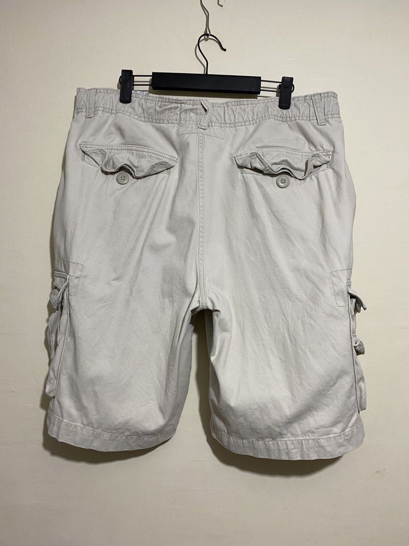 FADED GLORY,Cargo shorts (Category: Shorts) located in Cavite. Submitted by jc_thrift95 (Listing ID 1467333565, Image 2). Description: - a pair of light beige or cream-colored men’s utility cargo shorts featuring a button fly, cream-colored drawstrings, and multiple pleated cargo pockets on the sides. - Made in Bangladesh - L- 22 inch - W- 18 inch - Color rate 8/10 - See picture details for dimes..