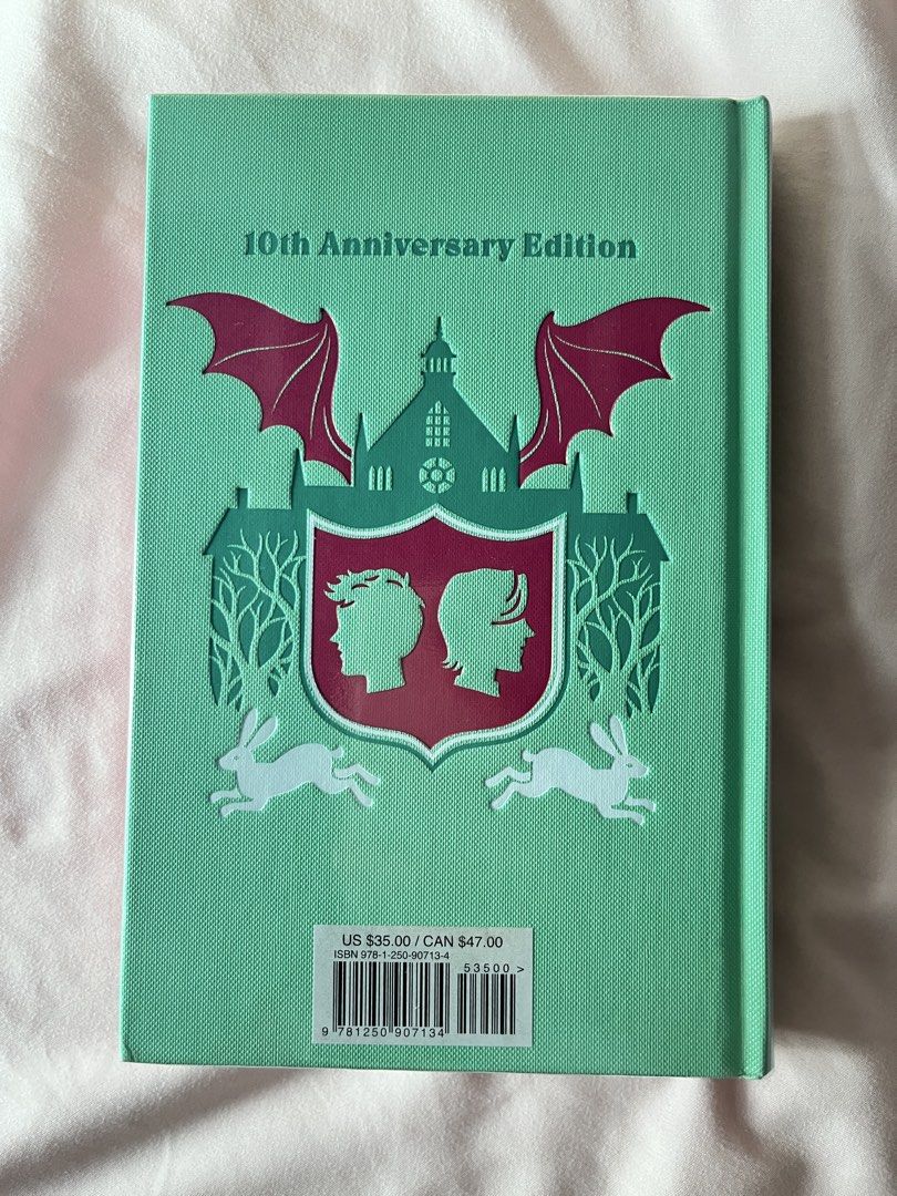 Fangirl 10th Anniversary Edition by Rainbow Rowell (Category: Storybooks) located in Manila. Submitted by lfaaaaa (Listing ID 1467219535, Image 2). Description: - Title: Fangirl (10th Anniversary Special Edition) by Rainbow Rowell - Format: Hardcover with stunning red and green foil design - Special Features: Custom sprayed edges with the iconic quote "read to me, sweetheart" Read only once With plastic cover.