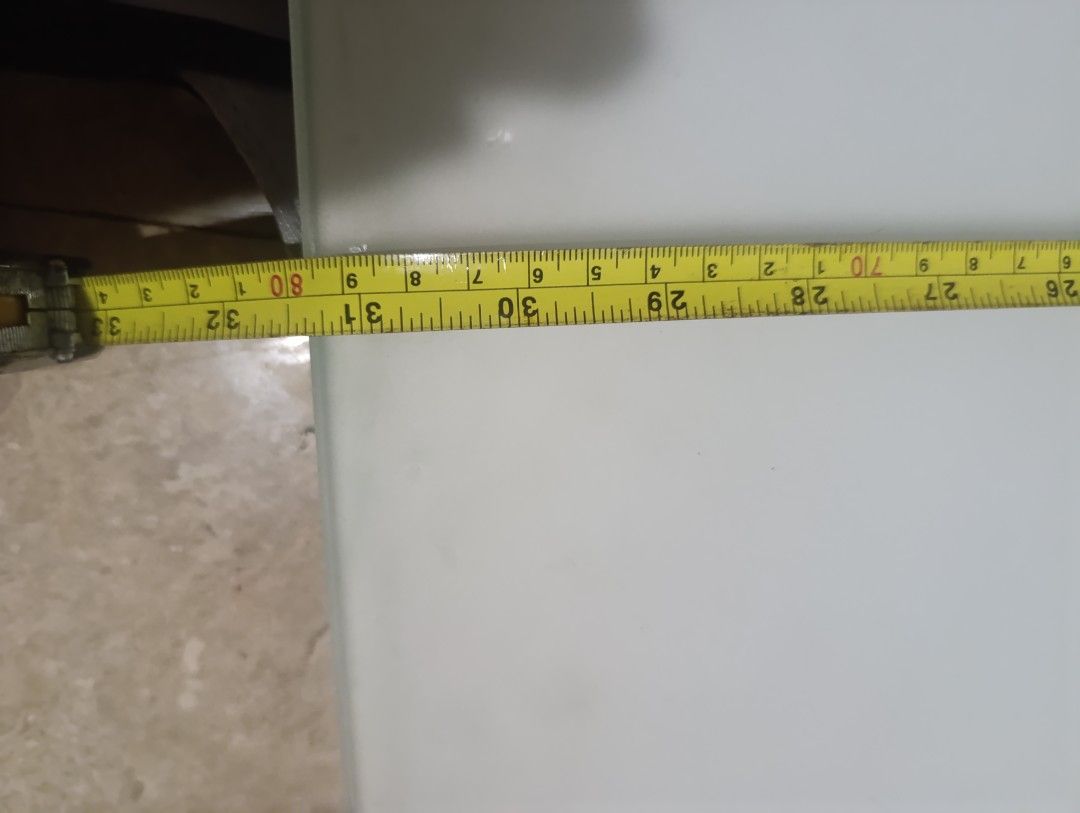 Faux marble glass table top replacement (Category: Tables & Sets) located in Quezon City. Submitted by kuruma_13 (Listing ID 1467245154, Image 2). Description: - Product: Rectangular glass table top - Design: White and green faux marble pattern - Dimensions: Approx. 82 cm x 59 cm. pls check - Features: Heavy glass material with fou circular corner mounts - Condition: Good overall, with minor discoloration marks and spots near the corners - Ideal 