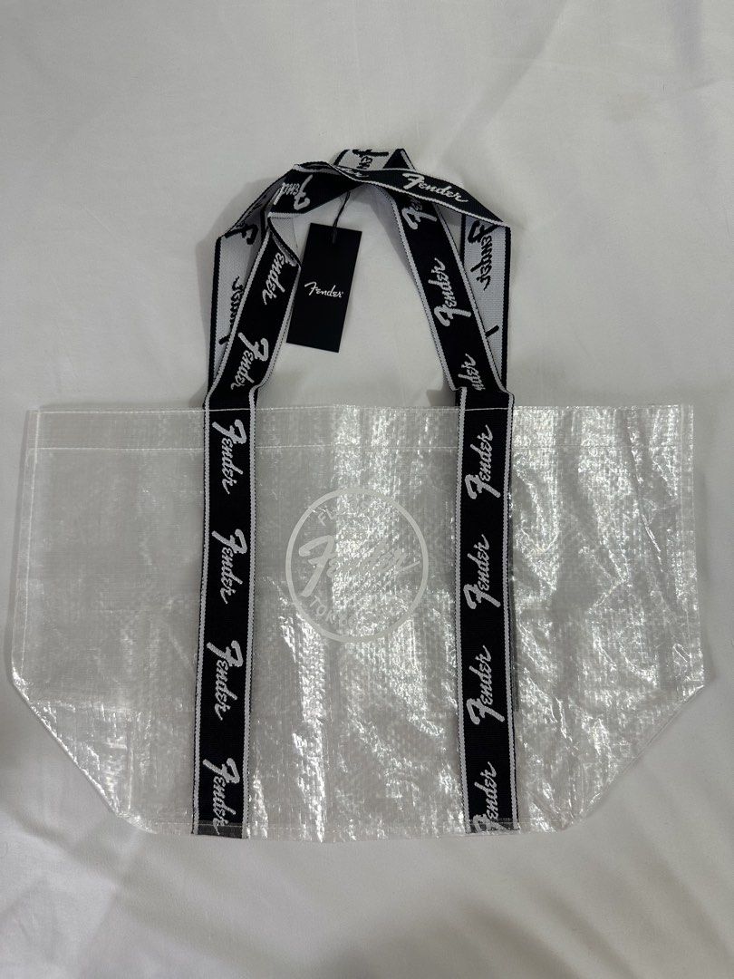 Fender Flagship Tokyo Eco Shopper Bag (Category: Tote Bags) located in Taytay. Submitted by j_r_t (Listing ID 1467183475, Image 1). Description: - 100% Authentic: Official Fender Flagship Tokyo merchandise, brand new with original store tags. - Eye-Catching Design: Clear translucent body featuring the iconic Fender Tokyo Est. 2023 front graphic. - Durable Build: Made of quality polyethylene and polyester with stylish black and white logo webbing 