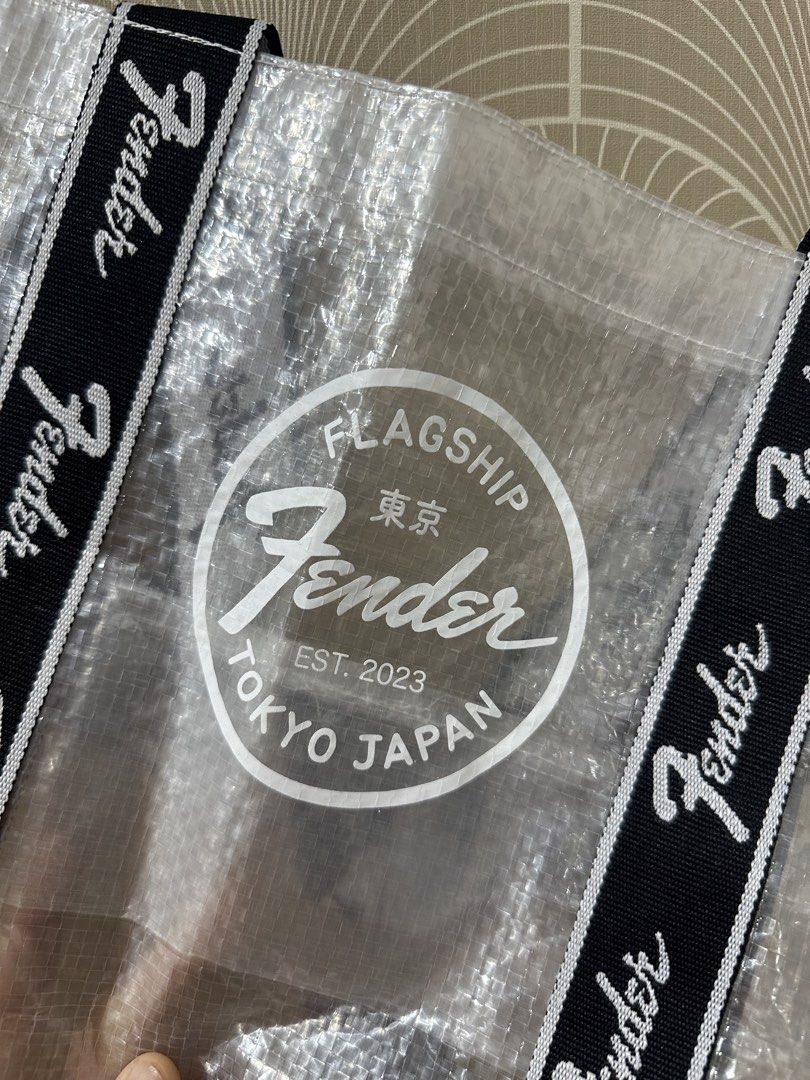Fender Flagship Tokyo Eco Shopper Bag (Category: Tote Bags) located in Taytay. Submitted by j_r_t (Listing ID 1467183475, Image 2). Description: - 100% Authentic: Official Fender Flagship Tokyo merchandise, brand new with original store tags. - Eye-Catching Design: Clear translucent body featuring the iconic Fender Tokyo Est. 2023 front graphic. - Durable Build: Made of quality polyethylene and polyester with stylish black and white logo webbing 