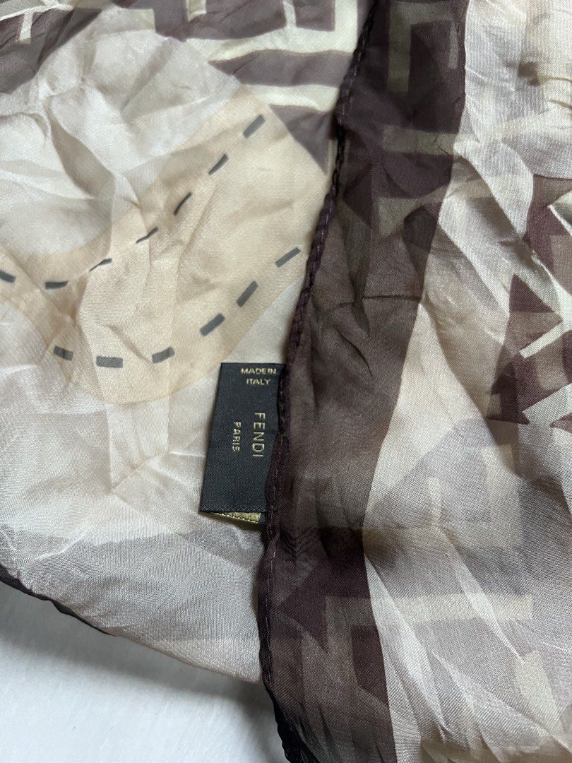 Fendi FF Monogram Silk Scarf Made in Italy (Category: Scarves) located in Zamboanga. Submitted by safe.haimer (Listing ID 1467329562, Image 2). Description: - Brand: Fendi - Design: Classic brown and beige FF monogram pattern with dark brown trim - Material: 100% Silk (Dry clean only) - Origin: Made in Italy - Condition: Excellent pre-loved condition - Perfect versatile accessory for any outfit or season.
