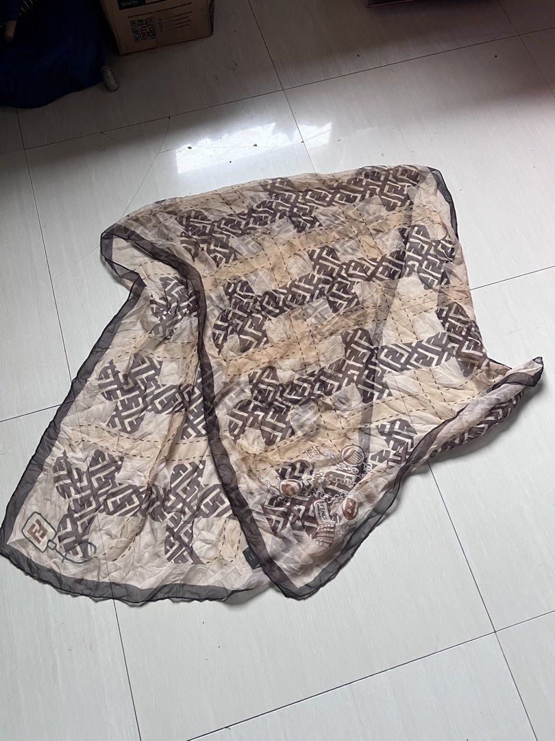 Fendi FF Monogram Silk Scarf Made in Italy (Category: Scarves) located in Zamboanga. Submitted by safe.haimer (Listing ID 1467329562, Image 1). Description: - Brand: Fendi - Design: Classic brown and beige FF monogram pattern with dark brown trim - Material: 100% Silk (Dry clean only) - Origin: Made in Italy - Condition: Excellent pre-loved condition - Perfect versatile accessory for any outfit or season.