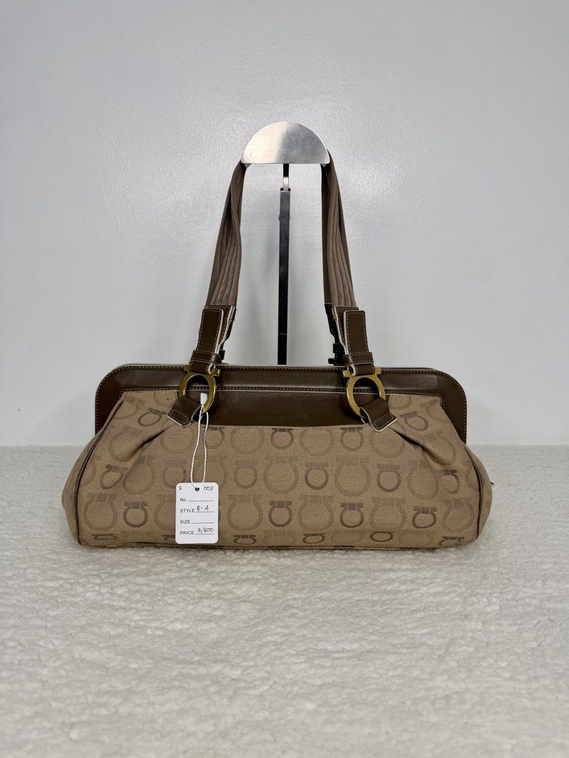 FERRAGAMO Gancini Jacquard Canvas Shoulder Bag (Category: Luxury Bags & Wallets) located in Quezon City. Submitted by madame_bagelia_collection (Listing ID 1467262691, Image 2). Description: 🔸Authentic 💯 🔸Preloved 🔸Rank A 🔸W/ minimal or unnoticeable signs of use. 🔸Canvas & leather material 🔸Gold color hardwares 🔸Zipper closure 🔸YKK zipper 🔸Fully lined interior 🔸Has 2 slip & 1 zip interior pockets 🔸Small to medium size 🔸Dimension (cm)