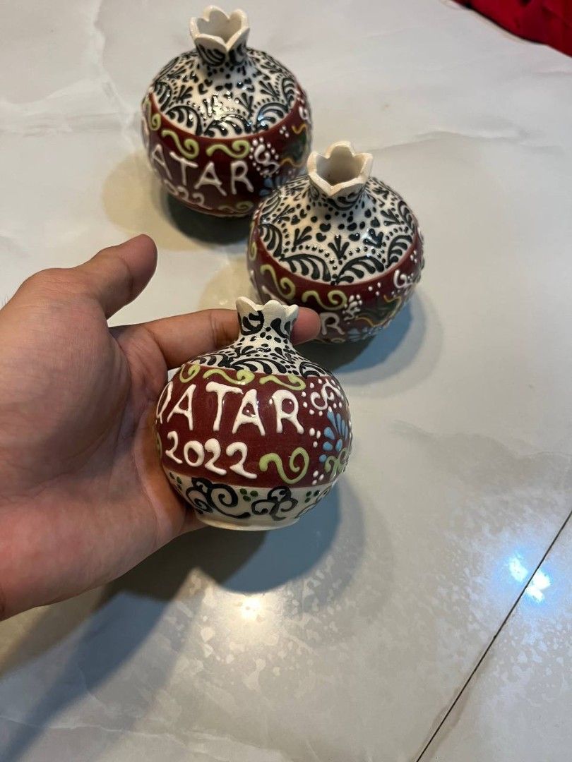 FIFA Collectible Vases 2022 (Category: Vintage Collectibles) located in Quezon City. Submitted by michypeachyy1 (Listing ID 1467263686, Image 3). Description: 2000 plus shipping only SET!! 3-piece set of hand-painted ceramic pomegranate bud vases commemorating Qatar 2022.