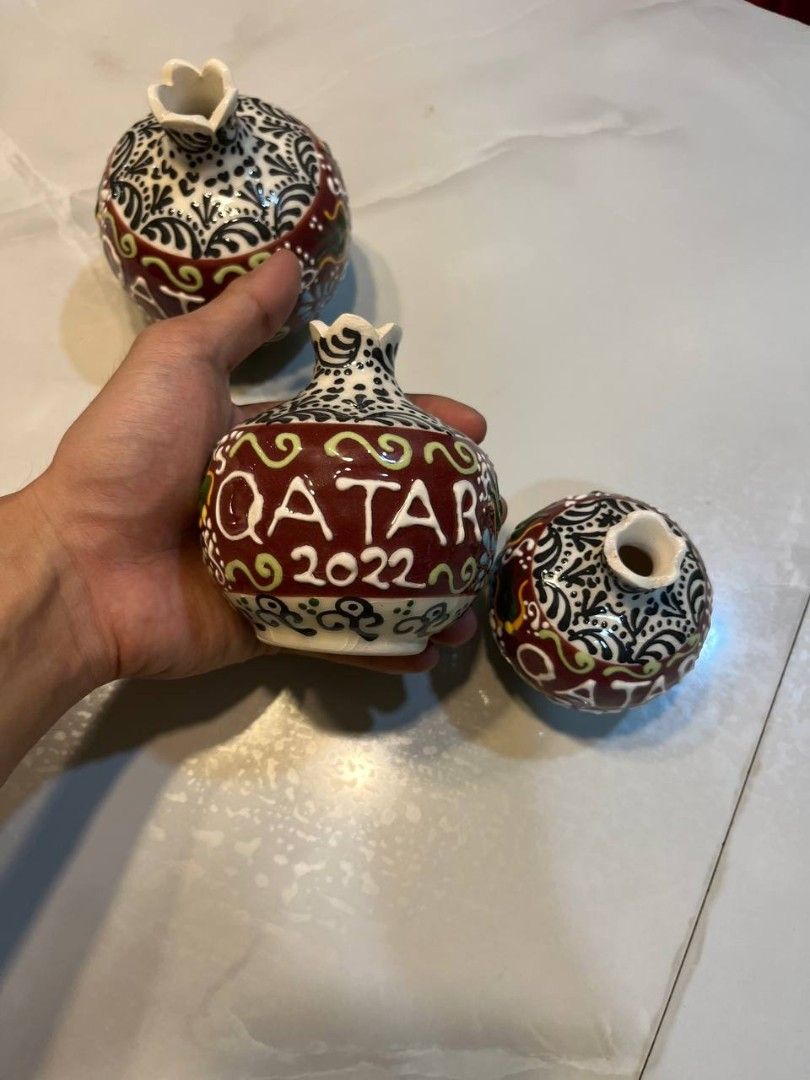 FIFA Collectible Vases 2022 (Category: Vintage Collectibles) located in Quezon City. Submitted by michypeachyy1 (Listing ID 1467263686, Image 1). Description: 2000 plus shipping only SET!! 3-piece set of hand-painted ceramic pomegranate bud vases commemorating Qatar 2022.