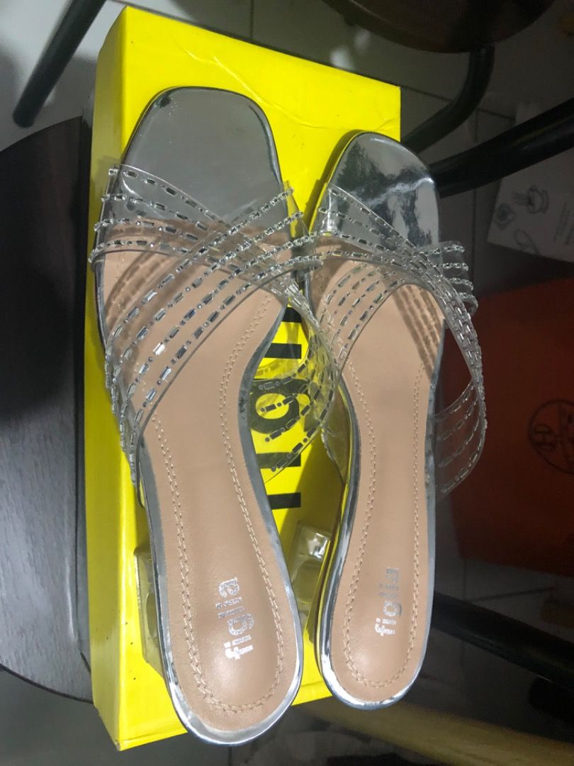 Figlia Amaya Silver Heels Size 39 (Category: Heels) located in Manila. Submitted by kissa.1890 (Listing ID 1467326142, Image 1). Description: - Brand: Figlia Amaya - Color: Silver with clear crystal-embellished strap design - Heel Type: Comfortable block heel - Size: 39 - Condition: Brand new, never worn - Inclusions: Original box in great shape (Bought from SM Store) - Original Price: ₱1,499.