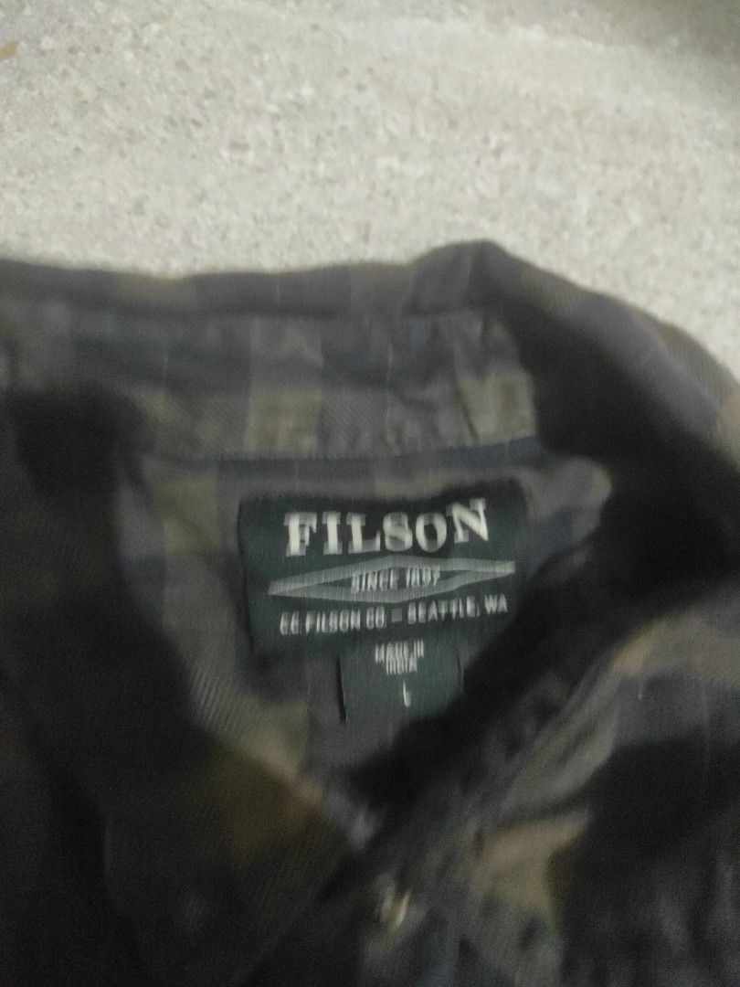 Filson Alaskan Guide Shirt (Category: Tshirts & Polo Shirts ) located in Santa Rosa. Submitted by y2kstylist (Listing ID 1467255565, Image 3). Description: - Brand: Filson - Style: Long sleeve button-down shirt - Pattern: Black and olive green plaid - Material: 100% breathable cotton - Features: Dual chest pockets with button flaps, standard collar, front button closure - Size: Large - Origin: Made in India - Condition: Excellent/Like new.
