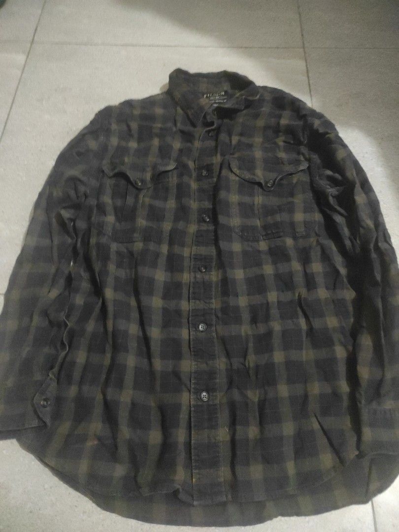 Filson Alaskan Guide Shirt (Category: Tshirts & Polo Shirts ) located in Santa Rosa. Submitted by y2kstylist (Listing ID 1467255565, Image 2). Description: - Brand: Filson - Style: Long sleeve button-down shirt - Pattern: Black and olive green plaid - Material: 100% breathable cotton - Features: Dual chest pockets with button flaps, standard collar, front button closure - Size: Large - Origin: Made in India - Condition: Excellent/Like new.