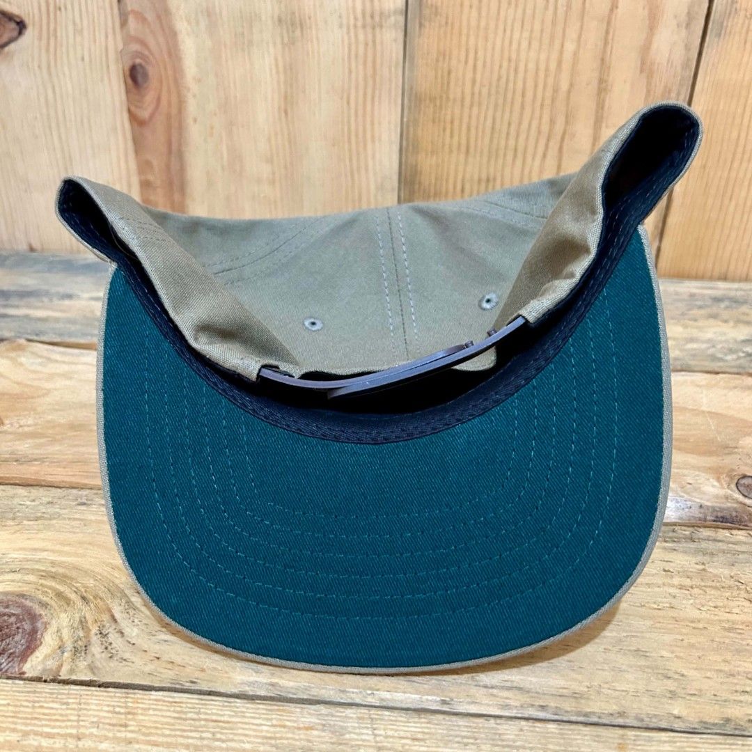 Filson snapback (Category: Caps & Hats) located in Legazpi City. Submitted by genobecollectives (Listing ID 1467311687, Image 2). Description: filson snapback 1000 free ship very good condition my sulatnlng ng ballpen kita sa piks. - Style: Snapback cap with a structured profile and flat brim - Color: Olive green canvas with dark green undervisor - Design: Classic bear graphic and "1897" printed on the front - Materials: 100% cotton shell, 100% p
