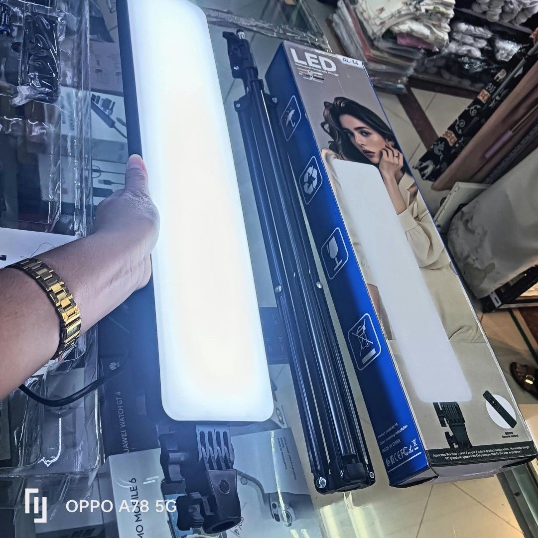 Flat Panel Fill Light RL-14 with Tripod Stand (Category: Lighting & Studio Equipment) located in Manila. Submitted by iliasjen3082126 (Listing ID 1467206008, Image 3). Description: - Model: RL-14 Flat Panel Fill Light - Ideal for: Content creation, photography, and video streaming - Includes: Adjustable tripod stand and power cable - Controls: Convenient on/off switch on the back panel - Packaging: Comes with original blue and white box - Conditi