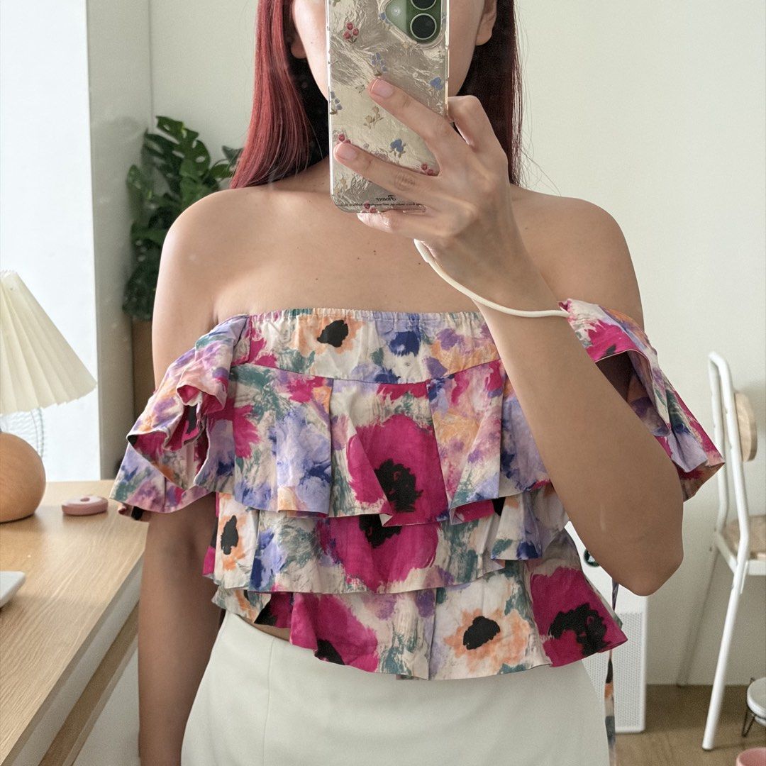 Floral crop top (Category: Sleeveless) located in Mandaluyong City. Submitted by shaine.dc (Listing ID 1467206565, Image 2). Description: - Best for XS-S - Colorful abstract floral print, dramatic ruffled shoulder straps, tiered ruffles, smocked back with tie closure - Can be worn off shoulder too.