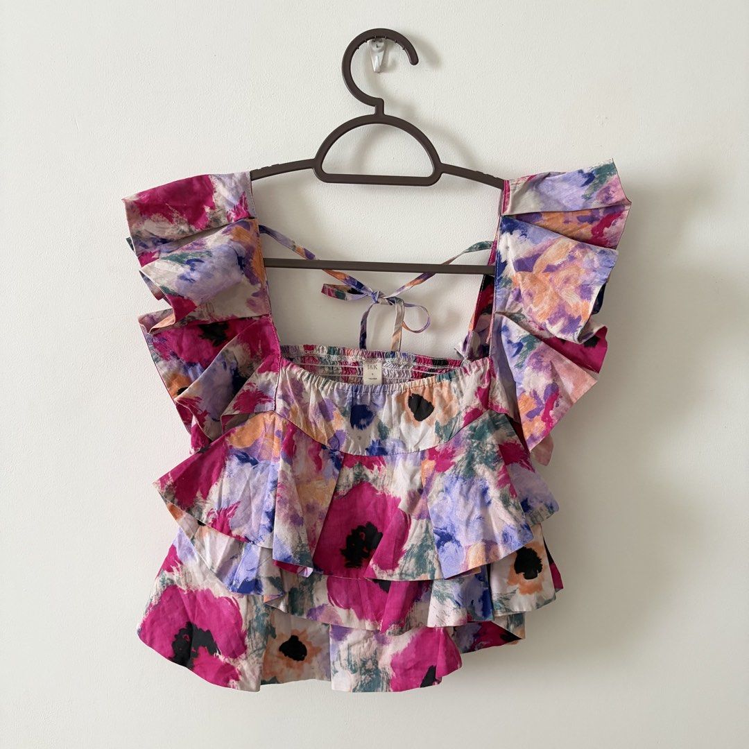 Floral crop top (Category: Sleeveless) located in Mandaluyong City. Submitted by shaine.dc (Listing ID 1467206565, Image 3). Description: - Best for XS-S - Colorful abstract floral print, dramatic ruffled shoulder straps, tiered ruffles, smocked back with tie closure - Can be worn off shoulder too.