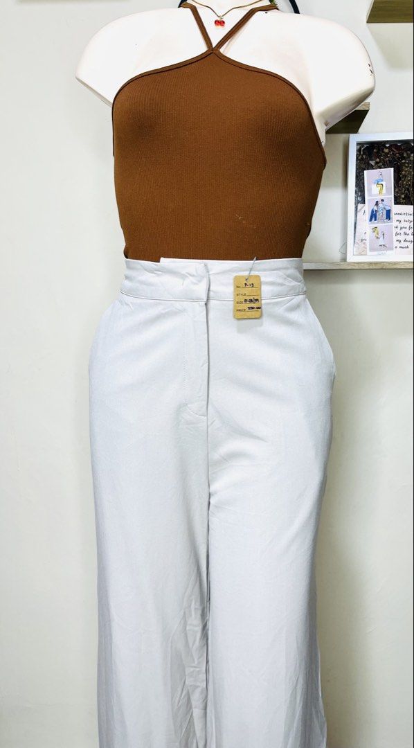 FLYMODEL Off-White High-Waisted Wide Leg Pants (Category: Jeans) located in Manila. Submitted by bengirlclothing (Listing ID 1467177149, Image 2). Description: -SIZE: 27-28 inches -LENGTH: 39 inches -FLYMODEL trousers in light grey or off-white. -High-waisted style with clean front waistband and belt loops. -Smooth fabric, great structure. -Pair with a basic tank or blouse for a clean look..