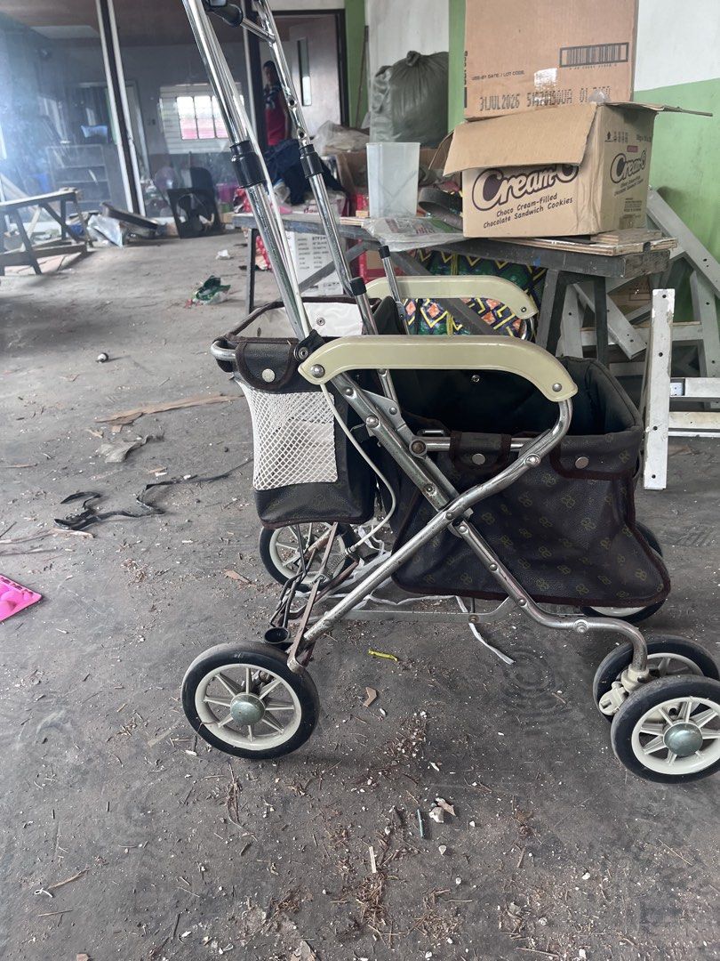 Dog cart/ stroller (Category: Homes & Other Pet Accessories) located in Manila. Submitted by rosechan429 (Listing ID 1467321479, Image 3). Description: Very matibay made in japan - Folding shopping trolley with durable chrome metal frame - Features a spacious main storage compartment and a convenient front mesh pouch - Stylish black and cream fabric design - Adjustable handlebar for comfortable pushing - Folds completely flat for easy storage - I
