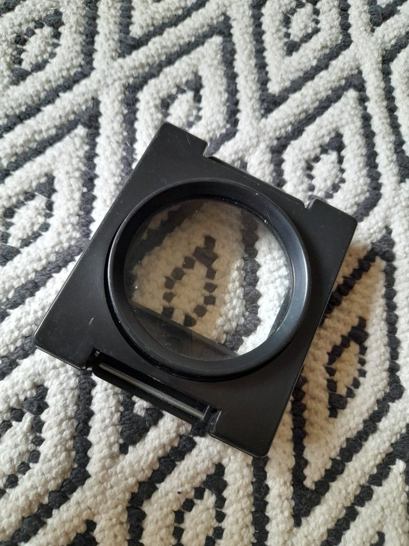 Folding Stand Magnifier with Built-In Measuring Scale (Category: Medical Supplies & Tools) located in Bocaue. Submitted by marajapansurplus (Listing ID 1467194009, Image 1). Description: - Color: Black - Design: Compact 3-panel folding stand that creates a stable square frame - Lens: Clear glass with an integrated measuring scale along the base - Build: Sturdy yet lightweight plastic construction - Portability: Folds completely flat for easy stor