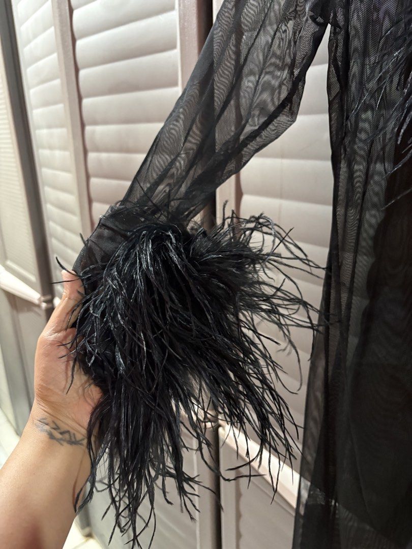 Forever21 Black Feather Trim Sheer Mesh Maxi Robe (Category: Dresses) located in Manila. Submitted by kindledph_ (Listing ID 1467169826, Image 3). Description: Size: S-Semi large - Brand: Forever 21 - Color: Black - Material: Sheer mesh, lightweight and flowy maxi length - Details: Fluffy feather cuffs and collar trim - Condition: Worn once for a photoshoot, zero flaws - Styling: Great statement piece to wear over a bodysuit or lingerie Used once