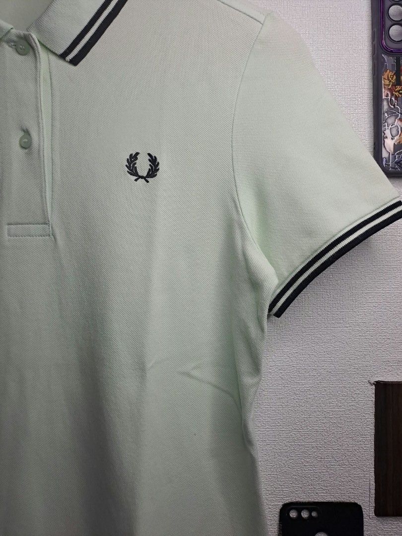 Fred Perry Light Sage - Green (Category: Shirts) located in Quezon City. Submitted by yaseen73 (Listing ID 1467350969, Image 2). Description: Authentic Fred Perry Light Sage - Green Embroidery Dark Twin - Tipped Detailing Along the Ribbed Collar and Cuffs, Cotton Stretchy Wearing Size : S / M Dimensions : W18 x L25 Color Rate : 9.9/10 ✔️ Issue : Yellow Stain/Transfered Color, Not Sure Washable or Not ✔️Excellent Condition 699 only Free Shipping V