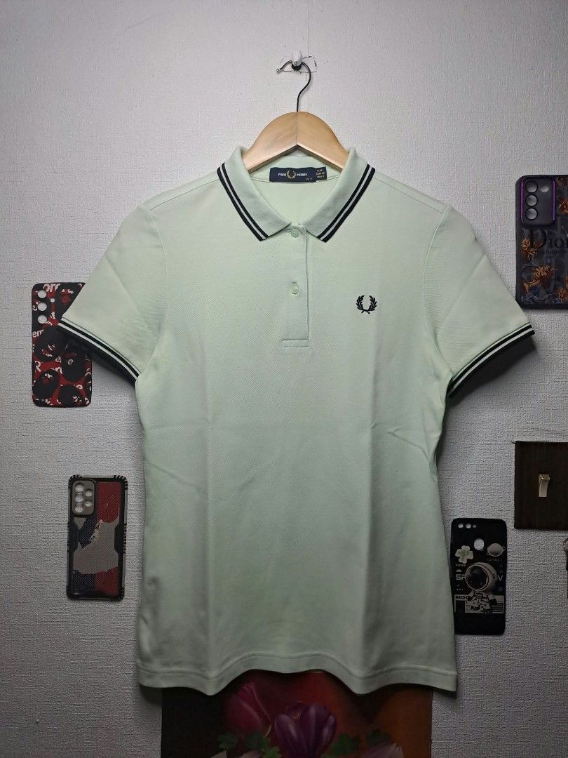 Fred Perry Light Sage - Green (Category: Shirts) located in Quezon City. Submitted by yaseen73 (Listing ID 1467350969, Image 1). Description: Authentic Fred Perry Light Sage - Green Embroidery Dark Twin - Tipped Detailing Along the Ribbed Collar and Cuffs, Cotton Stretchy Wearing Size : S / M Dimensions : W18 x L25 Color Rate : 9.9/10 ✔️ Issue : Yellow Stain/Transfered Color, Not Sure Washable or Not ✔️Excellent Condition 699 only Free Shipping V