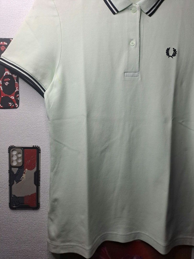 Fred Perry Light Sage - Green (Category: Shirts) located in Quezon City. Submitted by yaseen73 (Listing ID 1467350969, Image 3). Description: Authentic Fred Perry Light Sage - Green Embroidery Dark Twin - Tipped Detailing Along the Ribbed Collar and Cuffs, Cotton Stretchy Wearing Size : S / M Dimensions : W18 x L25 Color Rate : 9.9/10 ✔️ Issue : Yellow Stain/Transfered Color, Not Sure Washable or Not ✔️Excellent Condition 699 only Free Shipping V