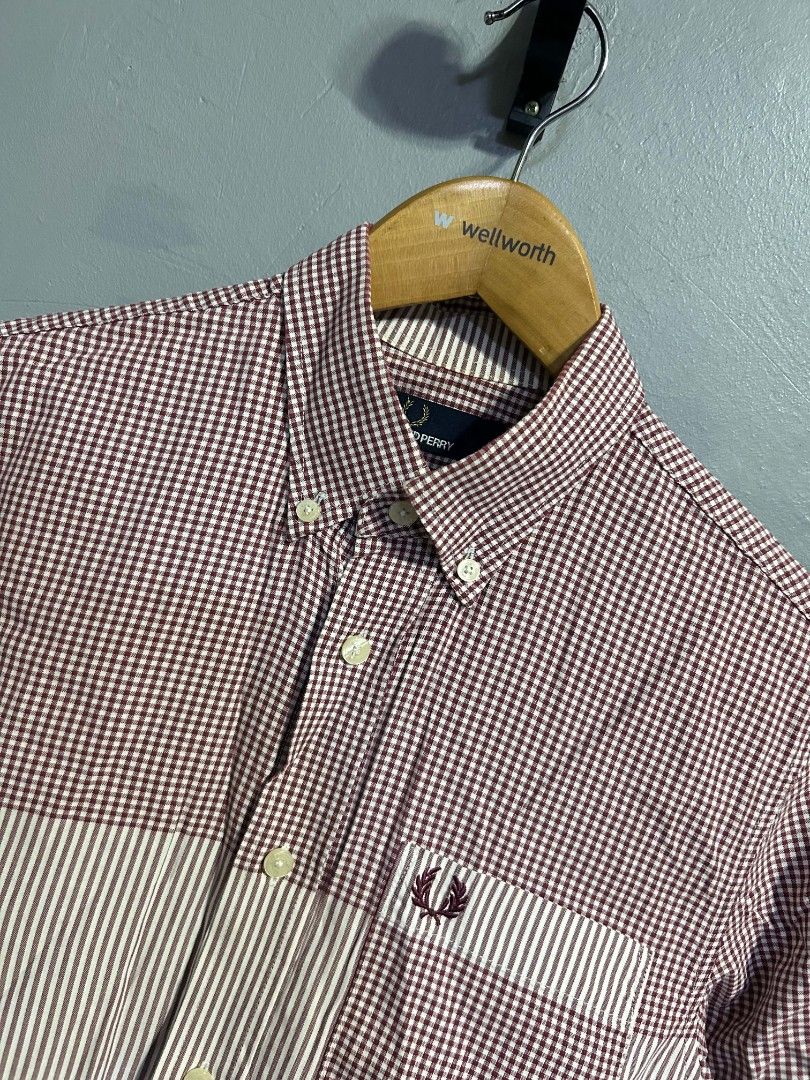 Fred Perry Long Sleeve Button Down Shirt Maroon Gingham (Category: Formal Shirts) located in Manila. Submitted by marjoriete27817 (Listing ID 1467192717, Image 2). Description: - Brand: Fred Perry - Style: Long sleeve button-down shirt with buttoned collar -size small 19*28 - Pattern: Burgundy & white gingham check with vertical striped chest panel - Details: Chest pocket and signature embroidered laurel wreath logo - Origin: Made in China - Prod