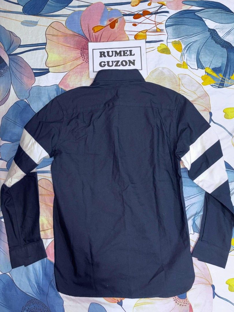 Fred Perry Navy Button-Down Long Sleeve Shirt (Category: Coats, Jackets and Outerwear) located in Quezon City. Submitted by rumel.guzon1630-15361 (Listing ID 1467191496, Image 2). Description: - Brand: Fred Perry - Color: Dark navy blue - Condition: like new with original tags attached - Details: Long sleeve, button-down front, classic collar - Accents: Signature embroidered laurel wreath logo on front pocket, contrasting white stripes on sleeve 