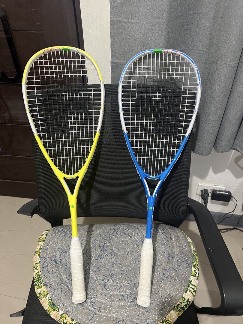 Frog Nanotitanium Squash Rackets Yellow and Blue Set (Category: Racket and Ball Sports) located in Manila. Submitted by ajdfinds (Listing ID 1467198708, Image 1). Description: - Set of 2 Frog Nanotitanium squash rackets (Yellow and Blue) - Strung and ready to play - Equipped with fresh white grips - Ideal for recreational play and practice sessions - Selling as a bundle.