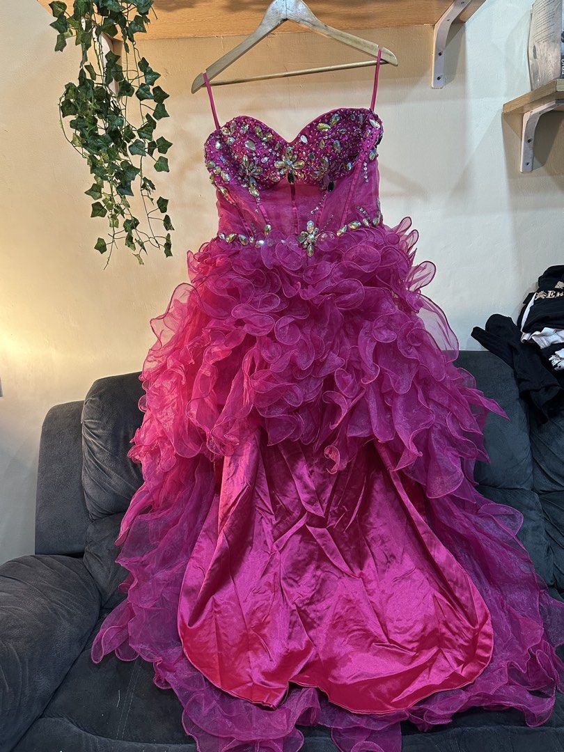 Fuchsia Rhinestone Prom Dress With Ruffles (Category: Evening dresses & gowns) located in Manila. Submitted by tenshiii185 (Listing ID 1467248799, Image 1). Description: - Color: Vibrant fuchsia pink - Design: Strapless with thin spaghetti straps, sweetheart bodice, and waistline heavily embellished with rhinestones - Skirt: Satin base with high-low, voluminous cascading ruffled tulle layers - Closure: Back zipper - Condition: Worn only once, pro