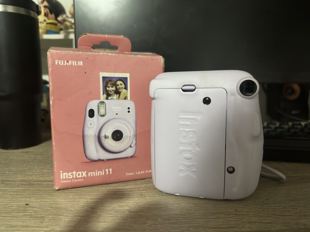 FUJIFILM Instax Mini 11 (Category: Cameras) located in Malabon City. Submitted by pluto23.5 (Listing ID 1467304419, Image 2). Description: Lilac Instax Mini 11 No issues. No film included. Comes with: box, batteries, strap.