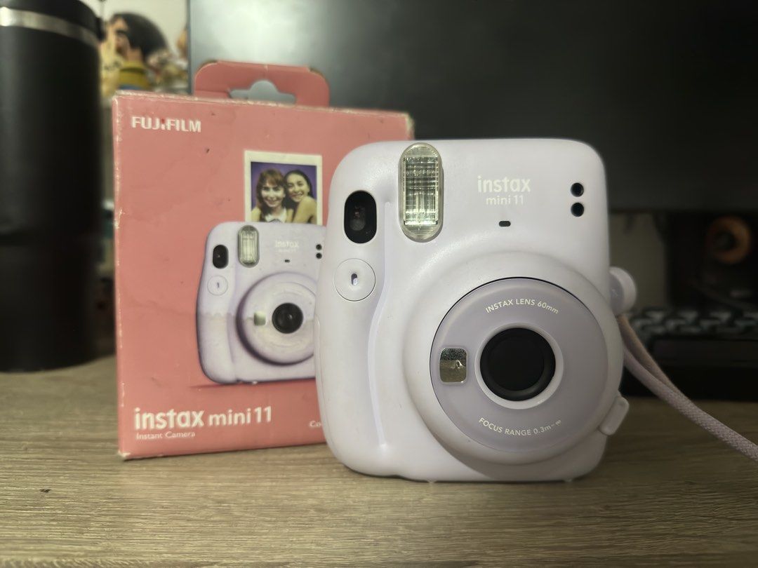 FUJIFILM Instax Mini 11 (Category: Cameras) located in Malabon City. Submitted by pluto23.5 (Listing ID 1467304419, Image 1). Description: Lilac Instax Mini 11 No issues. No film included. Comes with: box, batteries, strap.