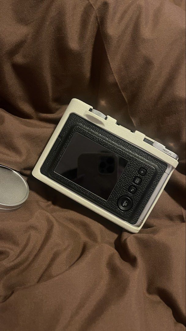 Fujifilm Instax Mini Evo Hybrid Instant Camera with Case (Category: Cameras) located in Manila. Submitted by danicoleons (Listing ID 1467238000, Image 3). Description: - Model: Fujifilm Instax Mini Evo Hybrid Instant Camera (White) - Inclusions: Matching cream leather protective case, lens cap, sd card, box, bag - Features: Digital screen, control buttons, and a classic print lever - Functionality: Shoot digitally, choose filters, and print direc