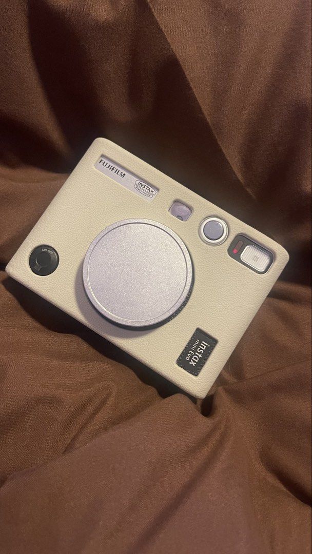Fujifilm Instax Mini Evo Hybrid Instant Camera with Case (Category: Cameras) located in Manila. Submitted by danicoleons (Listing ID 1467238000, Image 2). Description: - Model: Fujifilm Instax Mini Evo Hybrid Instant Camera (White) - Inclusions: Matching cream leather protective case, lens cap, sd card, box, bag - Features: Digital screen, control buttons, and a classic print lever - Functionality: Shoot digitally, choose filters, and print direc
