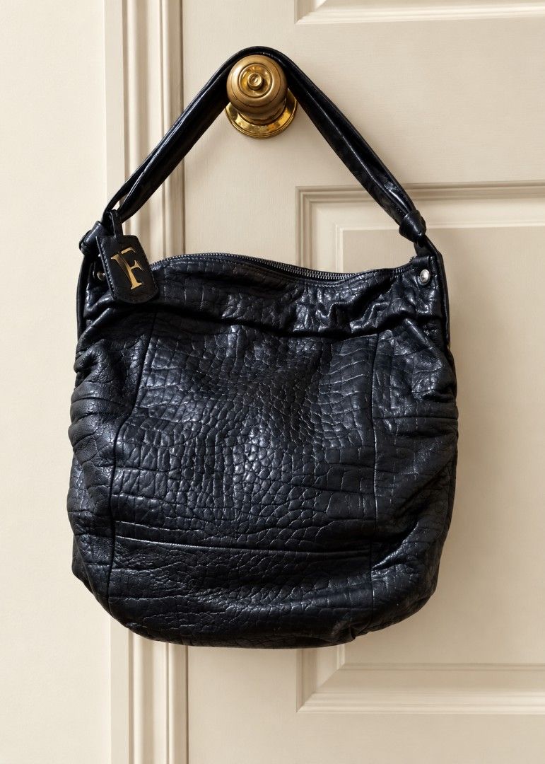 Furla hobo croc embossed bag (Category: Luxury Bags & Wallets) located in Manila. Submitted by sel1nan3k0 (Listing ID 1412499954, Image 1). Description: FURLA orig. Genuine Hobo bag. Sleek & Versatile and practical. Unique croc embossed detail on soft leather. check on the images of the quality level of the leather of this hobo bag. color: black onyx With dustbag/auth. Cards. Excellent condition. no leather peeling . Clean, not from thrift store.