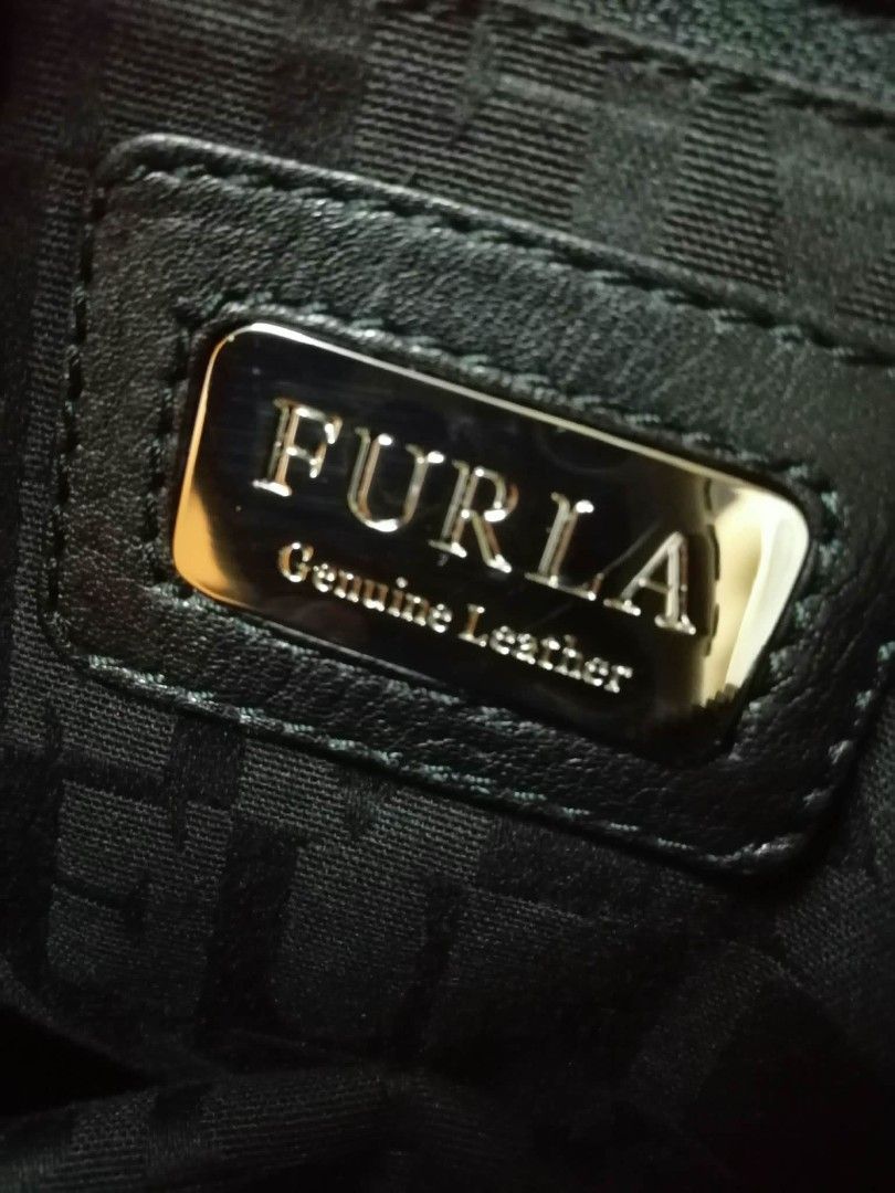 Furla hobo croc embossed bag (Category: Luxury Bags & Wallets) located in Manila. Submitted by sel1nan3k0 (Listing ID 1412499954, Image 3). Description: FURLA orig. Genuine Hobo bag. Sleek & Versatile and practical. Unique croc embossed detail on soft leather. check on the images of the quality level of the leather of this hobo bag. color: black onyx With dustbag/auth. Cards. Excellent condition. no leather peeling . Clean, not from thrift store.