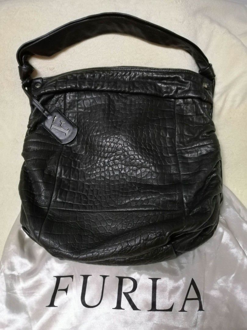 Furla hobo croc embossed bag (Category: Luxury Bags & Wallets) located in Manila. Submitted by sel1nan3k0 (Listing ID 1412499954, Image 2). Description: FURLA orig. Genuine Hobo bag. Sleek & Versatile and practical. Unique croc embossed detail on soft leather. check on the images of the quality level of the leather of this hobo bag. color: black onyx With dustbag/auth. Cards. Excellent condition. no leather peeling . Clean, not from thrift store.