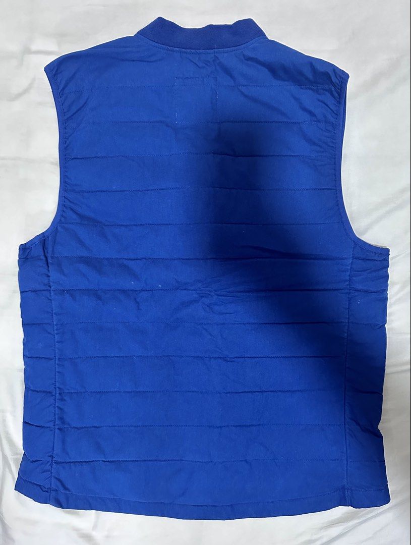 GAP Blue Quilted Puffer Vest (Category: Coats, Jackets and Outerwear) located in Quezon City. Submitted by aussomefinds (Listing ID 1467208913, Image 2). Description: - Brand: Gap - Color: Bright Blue - Size: L - Material: Quilted puffer - Closure: Snap button front - Collar: Ribbed style - Origin: Made in Indonesia - Condition: Great casual layering piece for cooler weather.