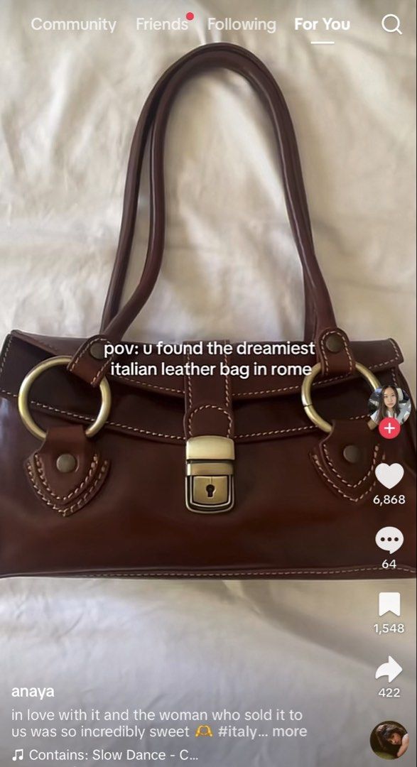Genuine Italian Leather Handbag Brown (Category: Luxury Bags & Wallets) located in Makati City. Submitted by onlinegaragesale. (Listing ID 1467193019, Image 2). Description: - Authentic brown leather handbag - Dimensions: 27 x 15 x 9 cm - Structured design with dual shoulder straps - Chic metallic ring hardware and metal lock closure - Convenient front flap pockets with contrast stitching - Clean and spacious interior compartment.