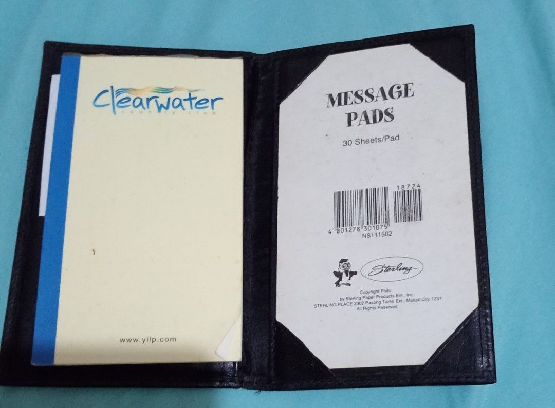 Genuine Leather Notepad Holder (Category: Stationery & School Supplies) located in Makati City. Submitted by YSL80022 (Listing ID 1467289766, Image 3). Description: - Material: Black genuine leather with light surface wear and minor scuffs from storage - Branding: Punta Baluarte logo stamped in gold on the inside pocket - Inclusions: Notepad inside - Design: Folding cover that closes neatly for easy carry or desk use RFS: decluttering .