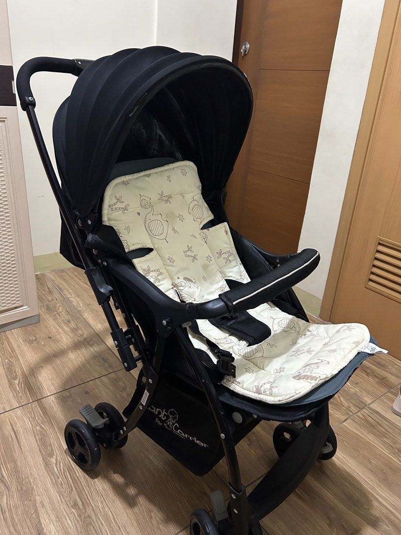 Giant Carrier Black Stroller (Category: Strollers) located in Manila. Submitted by declutteringkz (Listing ID 1467170204, Image 2). Description: - FREE Stroller Cushion - Color: Black frame - Safety: Secure harness and sturdy bumper bar for your little one - Comfort & Protection: Large adjustable canopy to shield from sun and wind - Storage: Convenient large basket underneath for bags and essentials - Portability: Compact fold mechanism for easy 