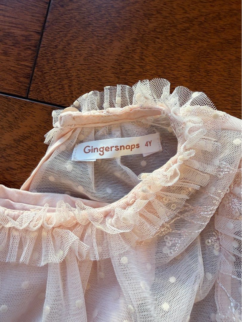 Gingersnaps Tulle Dress Size 4Y (Category: Babies & Kids Fashion) located in Makati City. Submitted by juju_08 (Listing ID 1467178274, Image 2). Description: - Brand: Gingersnaps - Color: Light pink - Size/Target: Toddler - Design: Long sleeves, polka dot pattern with delicate embroidery, tiered ruffle collar, and smocked elastic waist - Closure: Button closure at the back neckline - Occasion: Great for parties and special occasions - Condition: 