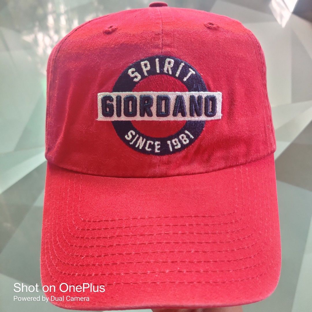 Giordano dadhat (Category: Caps & Hats) located in Baguio. Submitted by ferns_garage.0924 (Listing ID 1467233141, Image 3). Description: This is a red Giordano "Spirit Since 1981" baseball cap, featuring a classic sports-heritage lifestyle aesthetic. Key Details & Specifications Brand: Giordano Material: Crafted from 100% cotton twill, which provides a durable, soft feel and natural breathability. color and condi: Burgundy Red 9/10 Design & Crown
