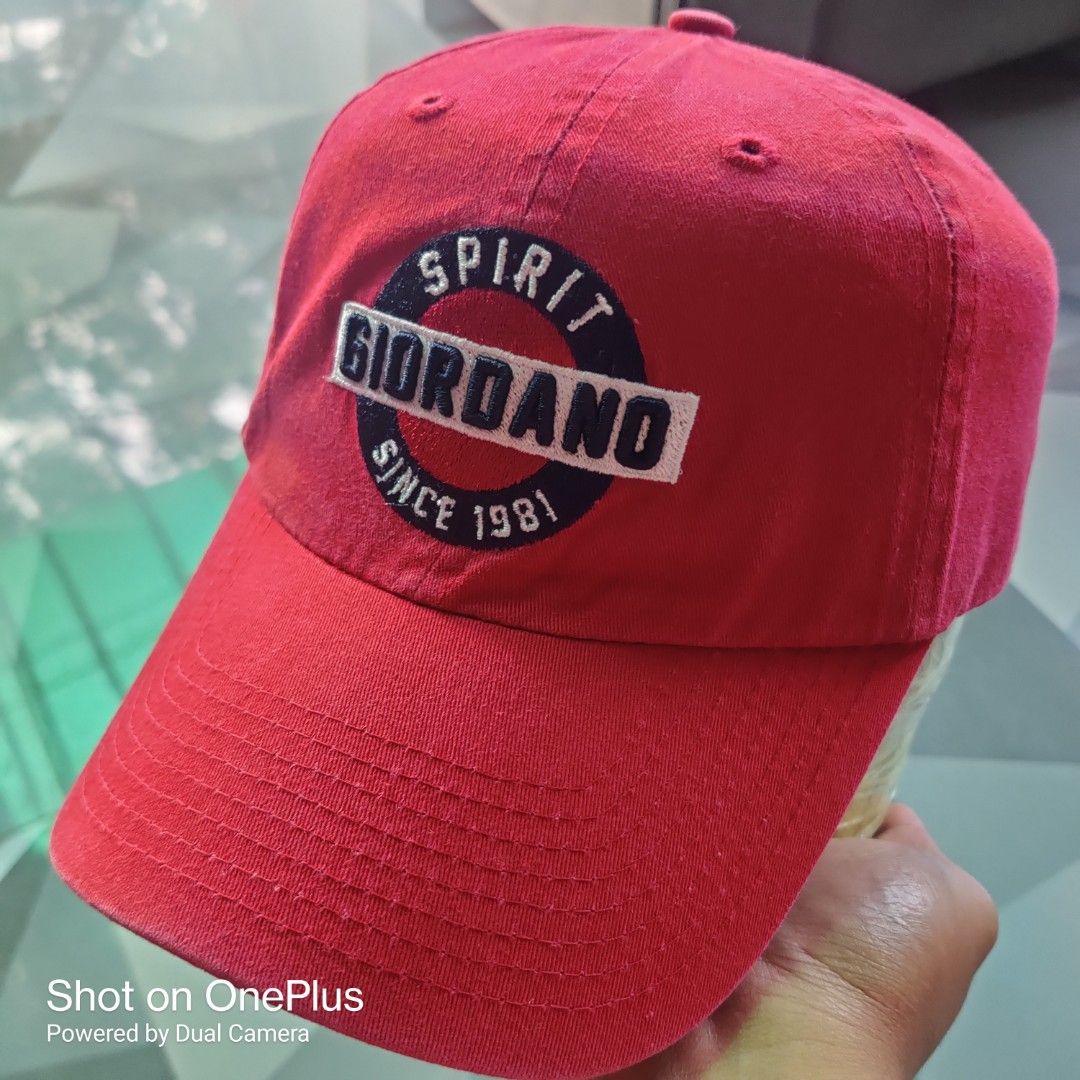 Giordano dadhat (Category: Caps & Hats) located in Baguio. Submitted by ferns_garage.0924 (Listing ID 1467233141, Image 2). Description: This is a red Giordano "Spirit Since 1981" baseball cap, featuring a classic sports-heritage lifestyle aesthetic. Key Details & Specifications Brand: Giordano Material: Crafted from 100% cotton twill, which provides a durable, soft feel and natural breathability. color and condi: Burgundy Red 9/10 Design & Crown