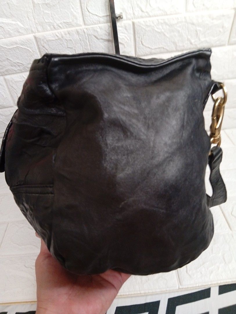 Givenchy Pandora Black Leather 2-way Handbag (Category: Luxury Bags & Wallets) located in Las Pinas. Submitted by etoksi1234 (Listing ID 1467246636, Image 3). Description: Pre-loved Givenchy Pandora black leather handbag with crinkled texture and gold-tone hardware. Features top handles, a detachable shoulder strap, a front magnetic pocket, and a spacious interior..
