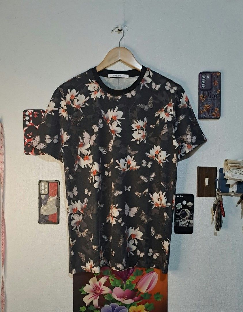 Givenchy Paris Floral & Butterfly (Category: Luxury Apparel) located in Quezon City. Submitted by yaseen73 (Listing ID 1467273736, Image 1). Description: Authentic Givenchy Paris Floral & Butterfly Print All Over Pattern pf White and Pale Peach Orchids Intermixed With Monochrome Butterflies on a Stark Black Backdrop. Made in Portugal - 100% Cotton - Wearing Size : XL on Tag - Width '20 - Length '28 - Color Rate 9.5/10 - Needs Wash - In Excellent 