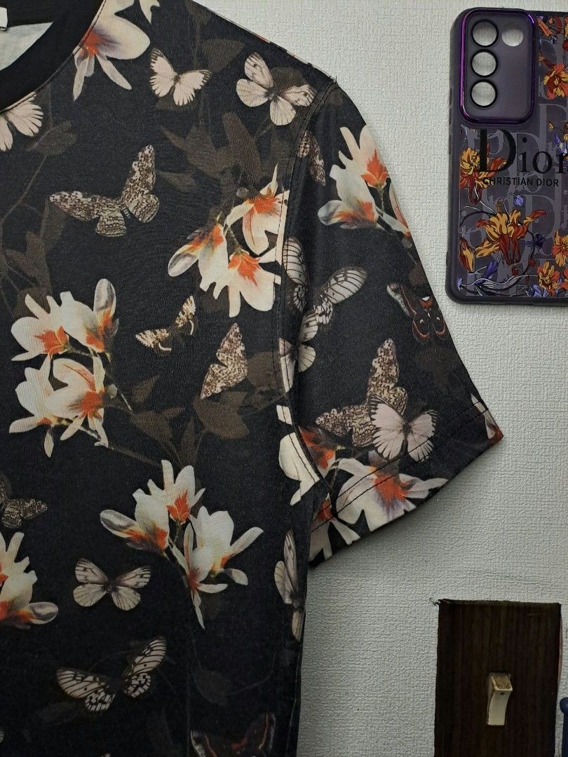 Givenchy Paris Floral & Butterfly (Category: Luxury Apparel) located in Quezon City. Submitted by yaseen73 (Listing ID 1467273736, Image 2). Description: Authentic Givenchy Paris Floral & Butterfly Print All Over Pattern pf White and Pale Peach Orchids Intermixed With Monochrome Butterflies on a Stark Black Backdrop. Made in Portugal - 100% Cotton - Wearing Size : XL on Tag - Width '20 - Length '28 - Color Rate 9.5/10 - Needs Wash - In Excellent 