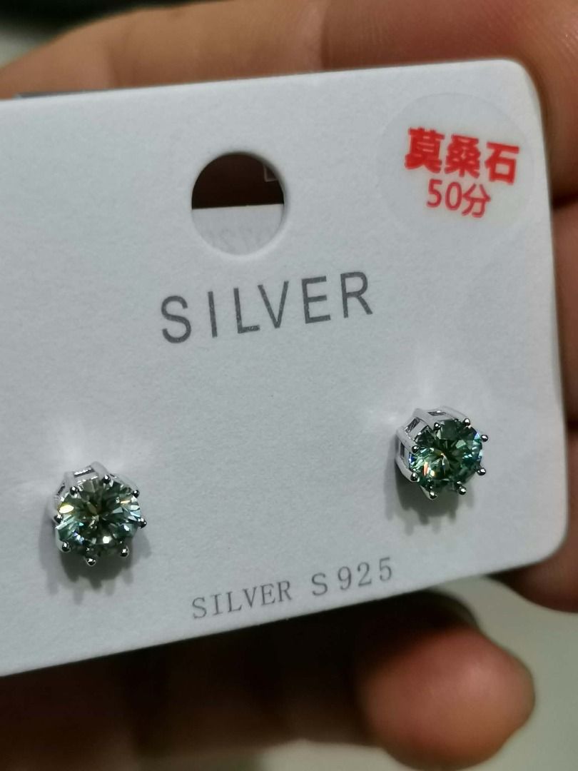 GME23 Green Moissanite Stud Silver Earrings (Category: Earrings) located in Cavite. Submitted by falconsclawset (Listing ID 1467321736, Image 1). Description: - Material: Genuine Silver S925 - Stone: Moissanite (0.50 carat / 50 points each) with brilliant sparkle - Setting: Classic, secure six-prong design - Condition: Brand new, unworn, comes on original retail card - Backing: Standard butterfly backs included - Style: Versatile and simple, perf