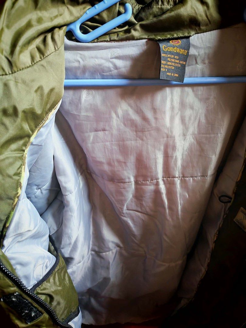 Gondwana Green Outdoor Jacket Size S (Category: Coats, Jackets and Outerwear) located in Manila. Submitted by samegrace (Listing ID 1467169986, Image 3). Description: - Brand: Gondwana - Size: S - Material: Nylon shell with polyurethane coating, polyester lining and fill - Color: Earth-tone color blocking (green, beige, and black panels) - Features: Attached hood with adjustable drawstrings, full front zipper closure - Condition: Great vintage ou