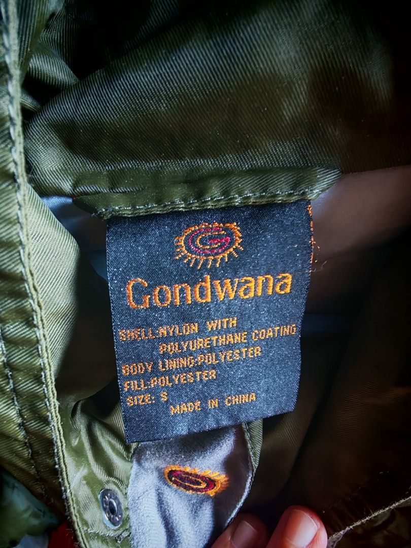 Gondwana Green Outdoor Jacket Size S (Category: Coats, Jackets and Outerwear) located in Manila. Submitted by samegrace (Listing ID 1467169986, Image 2). Description: - Brand: Gondwana - Size: S - Material: Nylon shell with polyurethane coating, polyester lining and fill - Color: Earth-tone color blocking (green, beige, and black panels) - Features: Attached hood with adjustable drawstrings, full front zipper closure - Condition: Great vintage ou